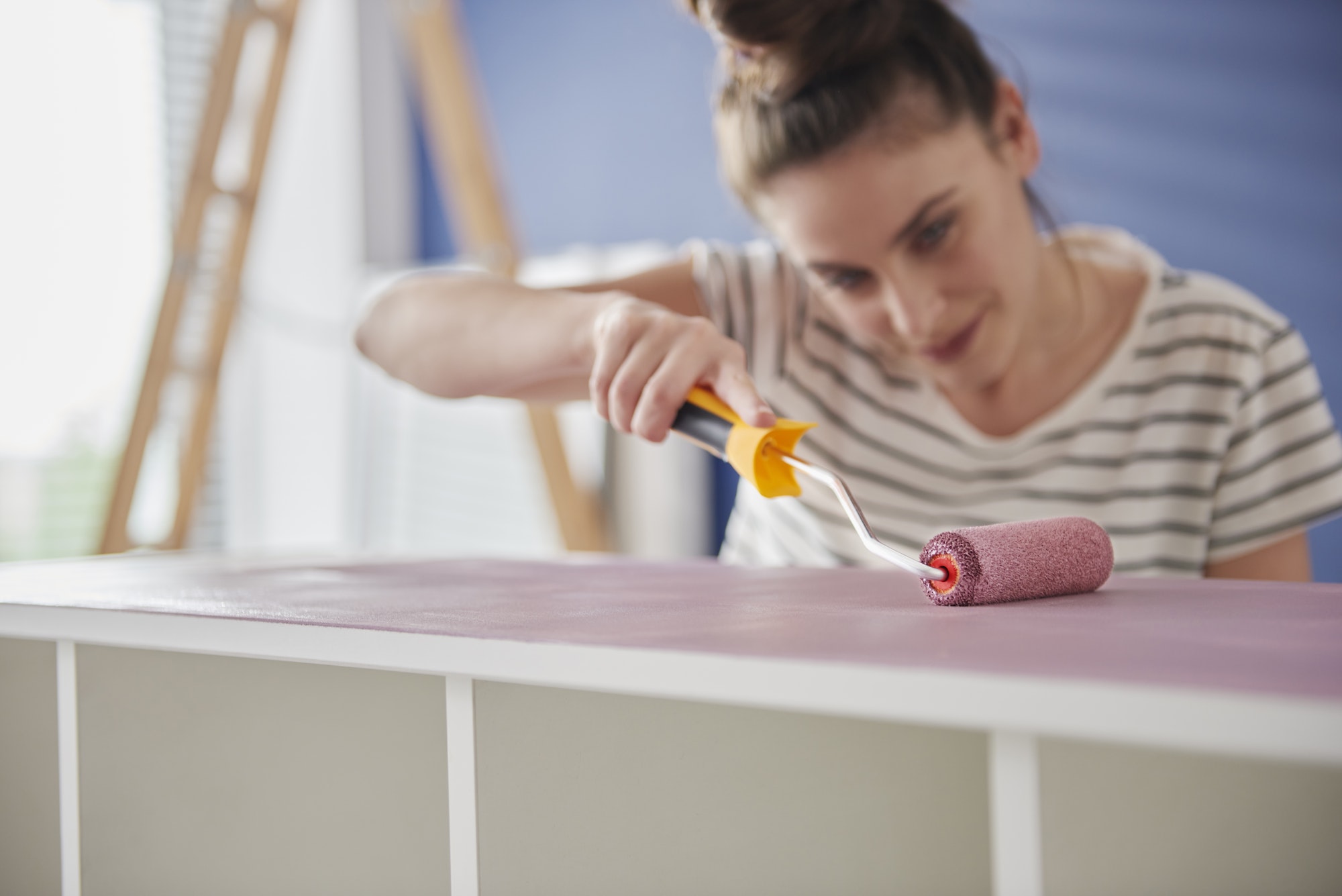 Focus woman painting old furnitures by herself